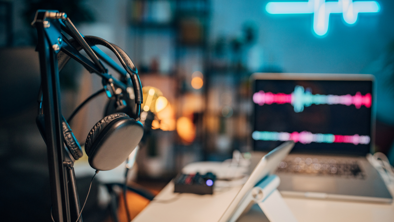 Podcast studio setup with headphones, microphone and neon lighting in Bali